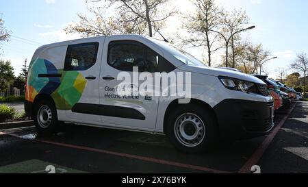 Peugeot e-Partner electric van, part of the City of Glen Eira EV fleet, parked in a council car park alongside other vehicles during an autumn day Stock Photo