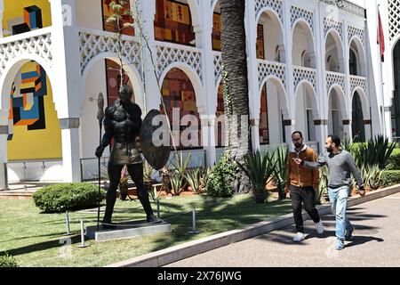 Rabat, Morocco. 17th May, 2024. People walk past a sculpture outside the Mohammed VI Museum of Modern and Contemporary Art in Rabat, Morocco, May 17, 2024. Credit: Huo Jing/Xinhua/Alamy Live News Stock Photo