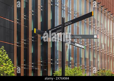 A signpost at the University of Birmingham provides navigation for students on campus. Stock Photo