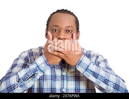man covering his mouth with hands Stock Photo