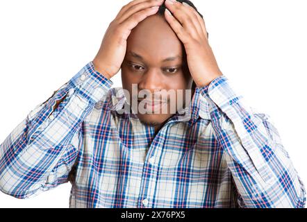 Portrait of a stressed sad young man having a headache Stock Photo