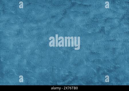 Texture of fluffy blue upholstery fabric or cloth. Fabric texture of artificial fur textile material. Canvas background. Decorative fabric for curtain Stock Photo