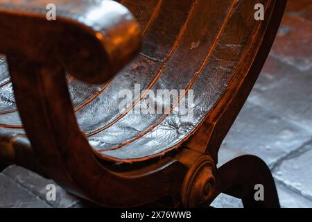 Gradara, Italy - August, 25, 2022: worn leather chair in Gradara Castle, Italy Stock Photo