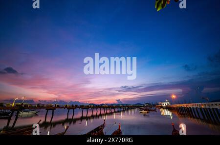 stunning colorful clouds in sunrise above Chalong pier. Scene of colorful yellow light through the clouds. Gradient color. Sky texture, abstract natur Stock Photo