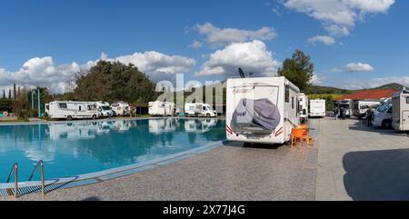 Ouezzane, Morocco - 2 Marhc, 2024: many motor homes and RVs parked around a swimming pool at a hotel in the Rif mountains of northern Morocco Stock Photo