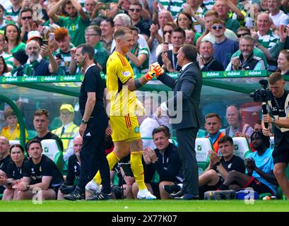 Celtic goalkeeper Joe Hart shakes hands with manager Brendan Rodgers after being substituted for team-mate Scott Bain during the cinch Premiership match at Celtic Park, Glasgow. Picture date: Saturday May 18, 2024. Stock Photo