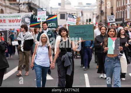 London, UK. 18th May 2024. Protesters march holding signs in support of Gaza. Credit: David Tramontan / Alamy Live News Stock Photo