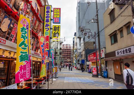 Osaka, Japan, April 16, 2024: Entertainment areas with restaurants and shops in Shinsekai. Stock Photo