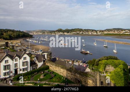 The Sailboats in the Harbour in the Conwy Estuary on a sunny afternoon in in the mediaeval Town of Conwy in North Wales Stock Photo