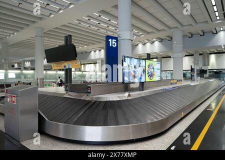HONG KONG, CHINA - DECEMBER 04, 2023: baggage claim area at Hong Kong International Airport Stock Photo