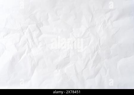 Wrinkled or crumpled white stencil paper or tissue after use in toilet or restroom with large copy space is used for background texture in decorative Stock Photo