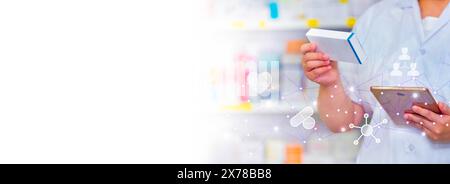 Pharmacist holding computer tablet using for filling prescription in pharmacy drugstore Stock Photo