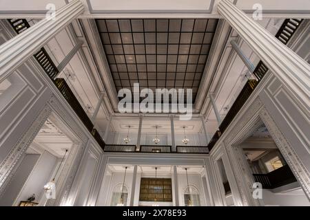 Niavaran Palace, Iran - March 7, 2024: Interior view highlights the intricate ceiling designs and ornate wall moldings of the historic Persian archite Stock Photo