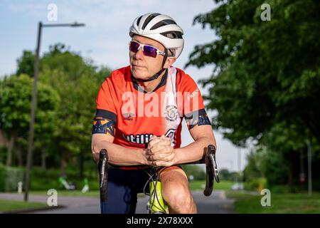 Mark Crowther, who has cycled to every Luton Town 2023/24 Premier League Away match for charity and to raise awareness of Mental Health at Milton Keyn Stock Photo