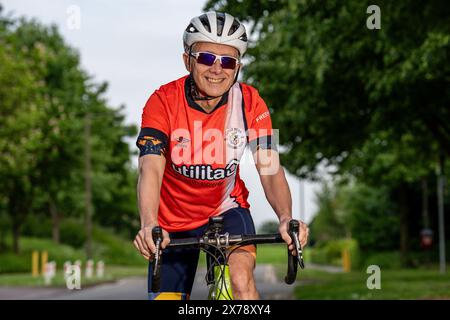 Mark Crowther, who has cycled to every Luton Town 2023/24 Premier League Away match for charity and to raise awareness of Mental Health at Milton Keyn Stock Photo