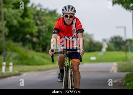 Mark Crowther, who has cycled to every Luton Town 2023/24 Premier League Away match for charity and to raise awareness of Mental Health at Milton Keyn Stock Photo