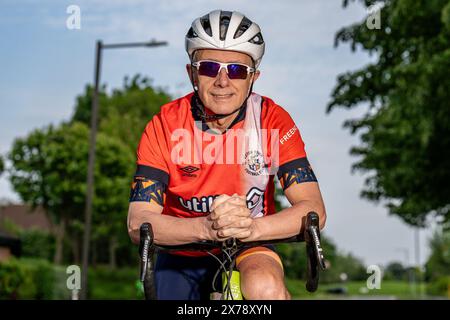 Mark Crowther, who has cycled to every Luton Town 2023/24 Premier League Away match for charity and to raise awareness of Mental Health at Milton Keyn Stock Photo