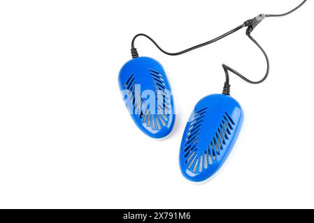 blue electric shoe dryer isolated on a white background. Stock Photo