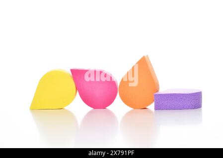 Colorful cosmetic makeup applicator sponge set isolated on white background. Stock Photo