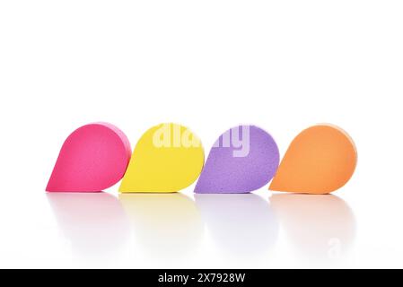 Colorful cosmetic makeup applicator sponge set isolated on white background. Stock Photo