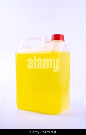 Plastic canister with pen and red cap, yellow liquid, mock up object, isolated on white background Stock Photo