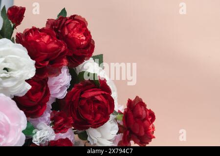 Bouquet red and white roses on pink background Stock Photo