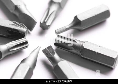 Different screwdriver bits on white background, closeup Stock Photo