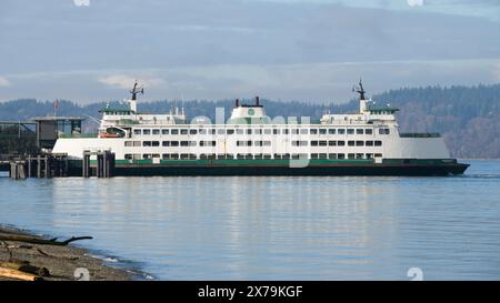 Mukilteo, WA, USA - February 7, 2024; Washington State car ferry MV Issaquah reflecting in water at dock Stock Photo