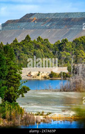 Waste dump and tailings dam near Savage River magnetite iron ore mine ...