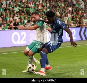 Austin, Texas, USA. 18th May, 2024. Austin FC midfielder Ethan Finlay (13) works against Sporting Kansas City forward Stephen Afrifa (30) during a Major League Soccer match on May 18, 2024 in Austin. Austin won, 3-2. (Credit Image: © Scott Coleman/ZUMA Press Wire) EDITORIAL USAGE ONLY! Not for Commercial USAGE! Stock Photo