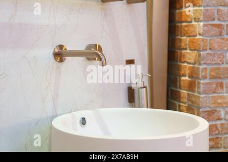 Modern faucet featuring a minimalist design and premium finish, it combines functionality with style Stock Photo