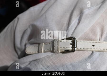 Old, white leather belt, strap isolated on white background Stock Photo