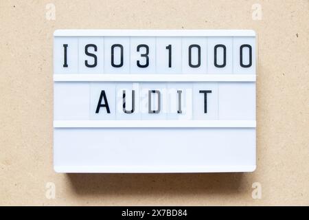 Lightbox with word ISO 31000 audit on wood background Stock Photo
