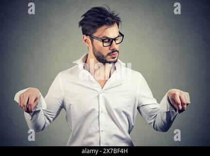 a man weighs all the pros and cons when making a decision Stock Photo