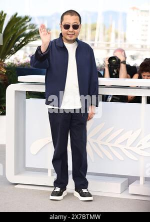 Cannes, France. 19th May, 2024. Chinese director Jia Zhangke poses during a photocall for the film 'Caught by the Tides' at the 77th Cannes Film Festival in Cannes, southern France, on May 19, 2024. Credit: Gao Jing/Xinhua/Alamy Live News Stock Photo