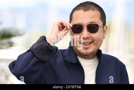 Cannes, France. 19th May, 2024. Chinese director Jia Zhangke poses during a photocall for the film 'Caught by the Tides' at the 77th Cannes Film Festival in Cannes, southern France, on May 19, 2024. Credit: Gao Jing/Xinhua/Alamy Live News Stock Photo