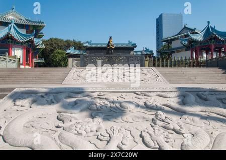 A large stone dragon mural in front of the goddess of the sea, Tian Hou, at the Chiwan Tian hou temple in Nanshan area of Shenzhen China. Stock Photo