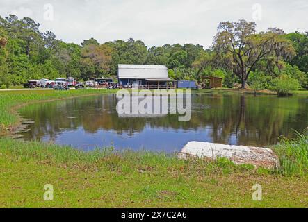 DAUFUSKIE ISLAND, SOUTH CAROLINA - April 6 2023: Front view of the Daufuskie Island Rum Company and reflection in a pond. Stock Photo