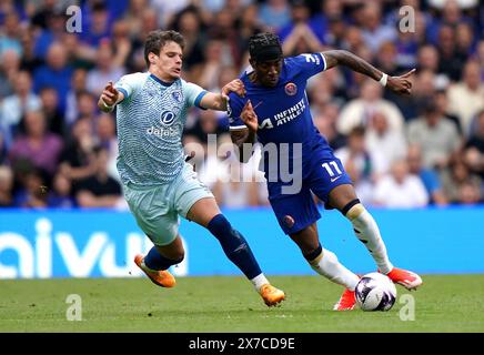 Chelsea's Noni Madueke (right) and Bournemouth's Milos Kerkez battle for the ball during the Premier League match at Stamford Bridge, London. Picture date: Sunday May 19, 2024. Stock Photo