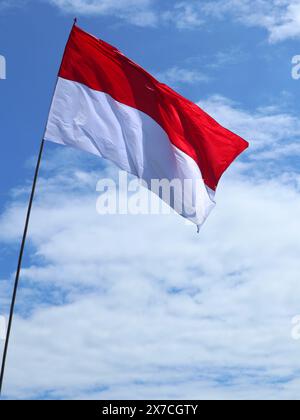 The Indonesian flag flies during the celebration of Indonesian Independence Day Stock Photo