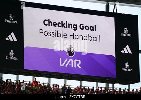 In-stadium screen displays “Checking Penalty” during a VAR review at ...