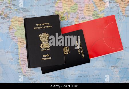 this image is about Two indian passports and flight ticket on the background of the world map Travel concept Stock Photo