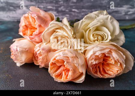 Bouquet of pink roses flower close-up over wooden background Stock Photo