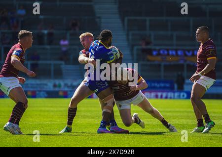 St Helens, Merseyside, UK. 19th May, 2024. Betfred Challenge Cup Rugby: Huddersfield Giants Vs Warrington Wolves at Totally Wicked Stadium. RODRICK TAI is tackled by two Huddersfield defenders. Credit James Giblin Photography/Alamy Live News. Stock Photo