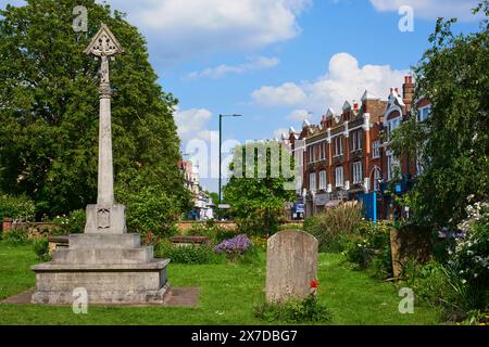 Barnes War Memorial in St Mary's churchyard, Barnes, London UK, in the Borough of Richmond-upon-Thames Stock Photo