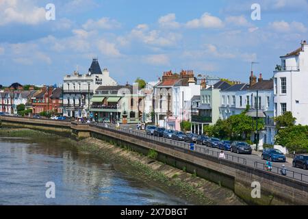 The riverfront at Barnes, West London UK, with buildings overlooking the River Thames, viewed from Barnes Bridge Stock Photo