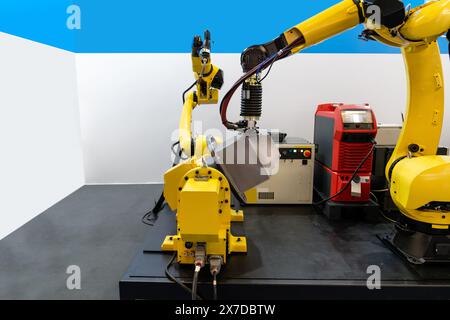 Welding robot arms on a smart factory. Stock Photo