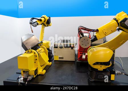 Welding robot arms on a smart factory. Stock Photo