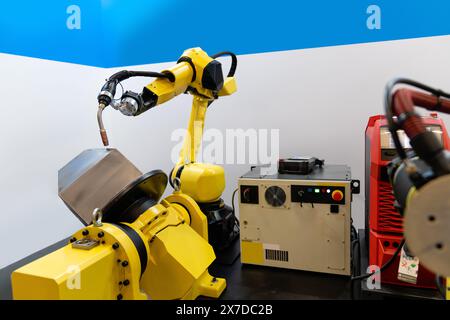 Welding robot arms on a smart factory. Stock Photo