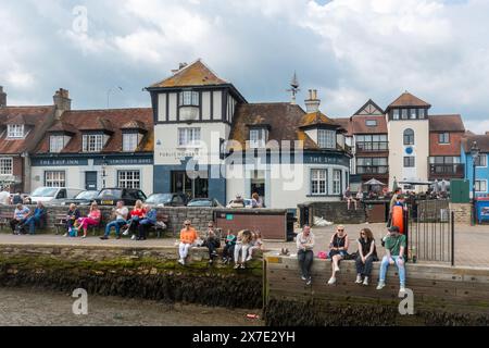 Lymington Harbour (Town Quay) with people relaxing on a warm Saturday in May, Hampshire, England, UK Stock Photo